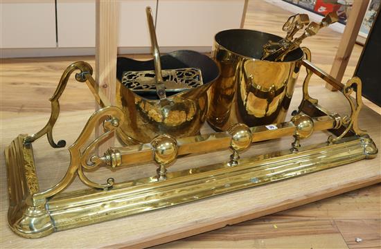 Victorian and later brass and copper, including a brass kerb, firescreen, copper coal helmet, brass coal box, kettle stand and a set of